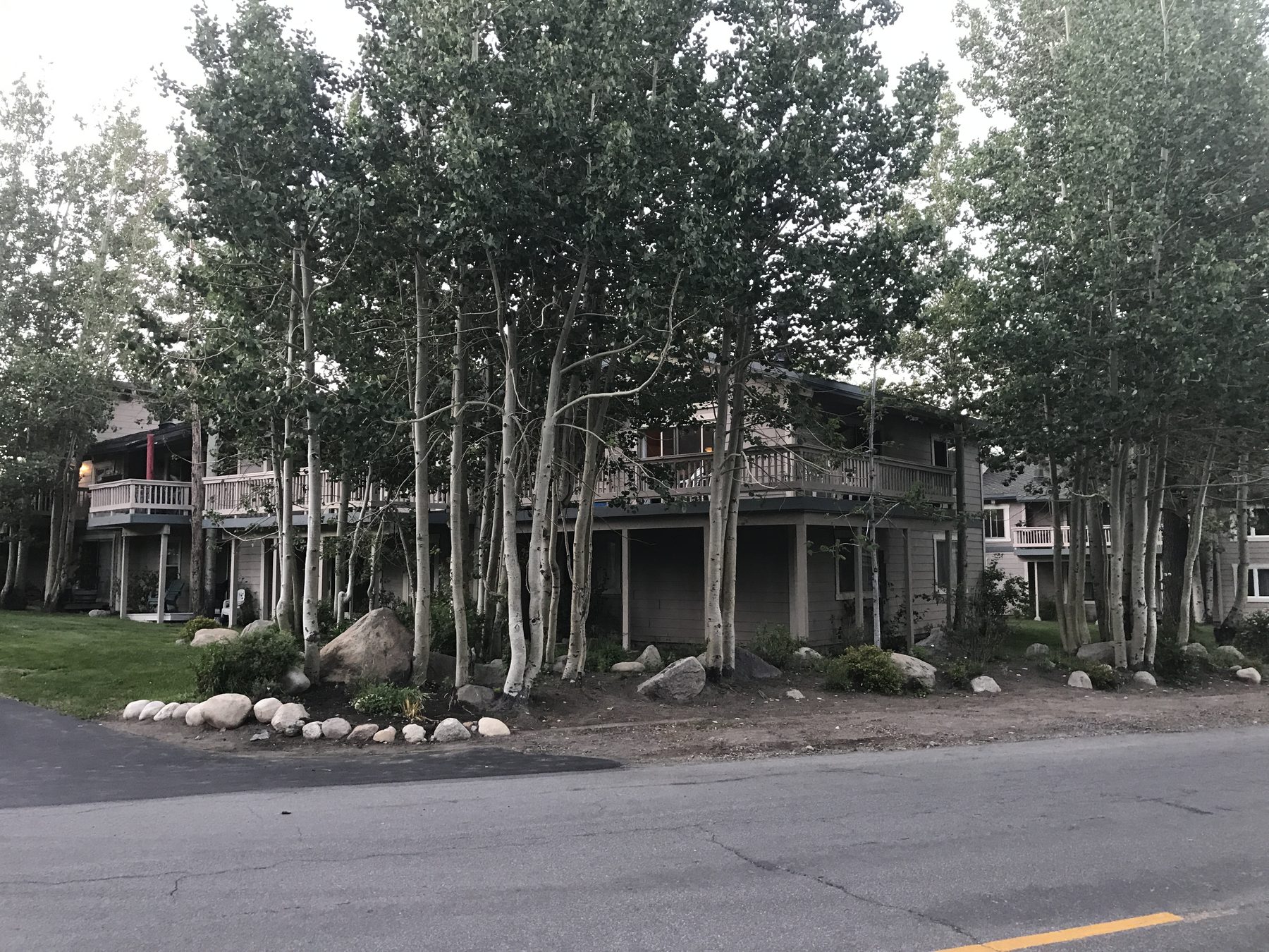 Condominiums behind the aspens off Old Mammoth Road — the stock nearly every price on this page describes
